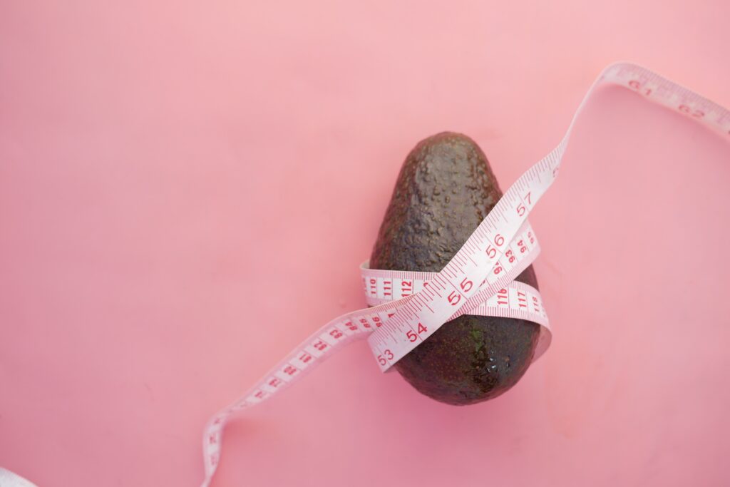 avocado with a measure tape